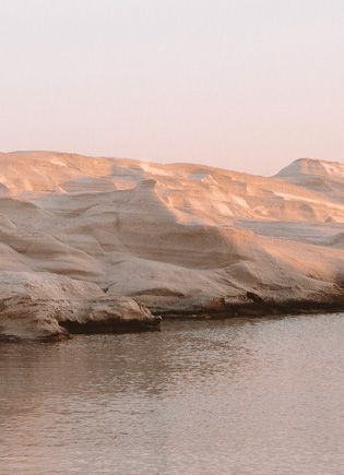 White Pebble Suites  branding web design rocks Milos sunlight